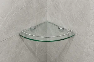 Modern glass bathroom corner shelf mounted on grey marble tiled wall