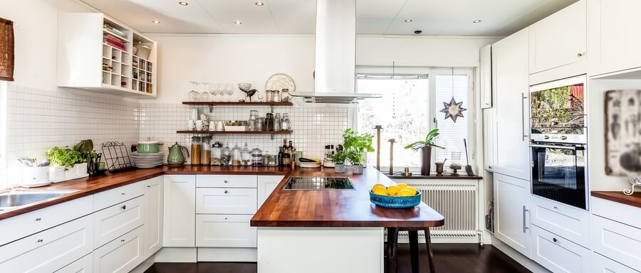 The area where the sink and the stove are placed is the main cooking area.