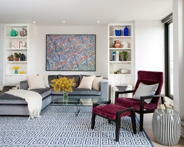 living-room-greek-key-rug-cococozy-sectional-sofa-velvet-gray-garden-stool-built-in-bookshelf-bookshelves-shelf-book-amy-elbaum-designs