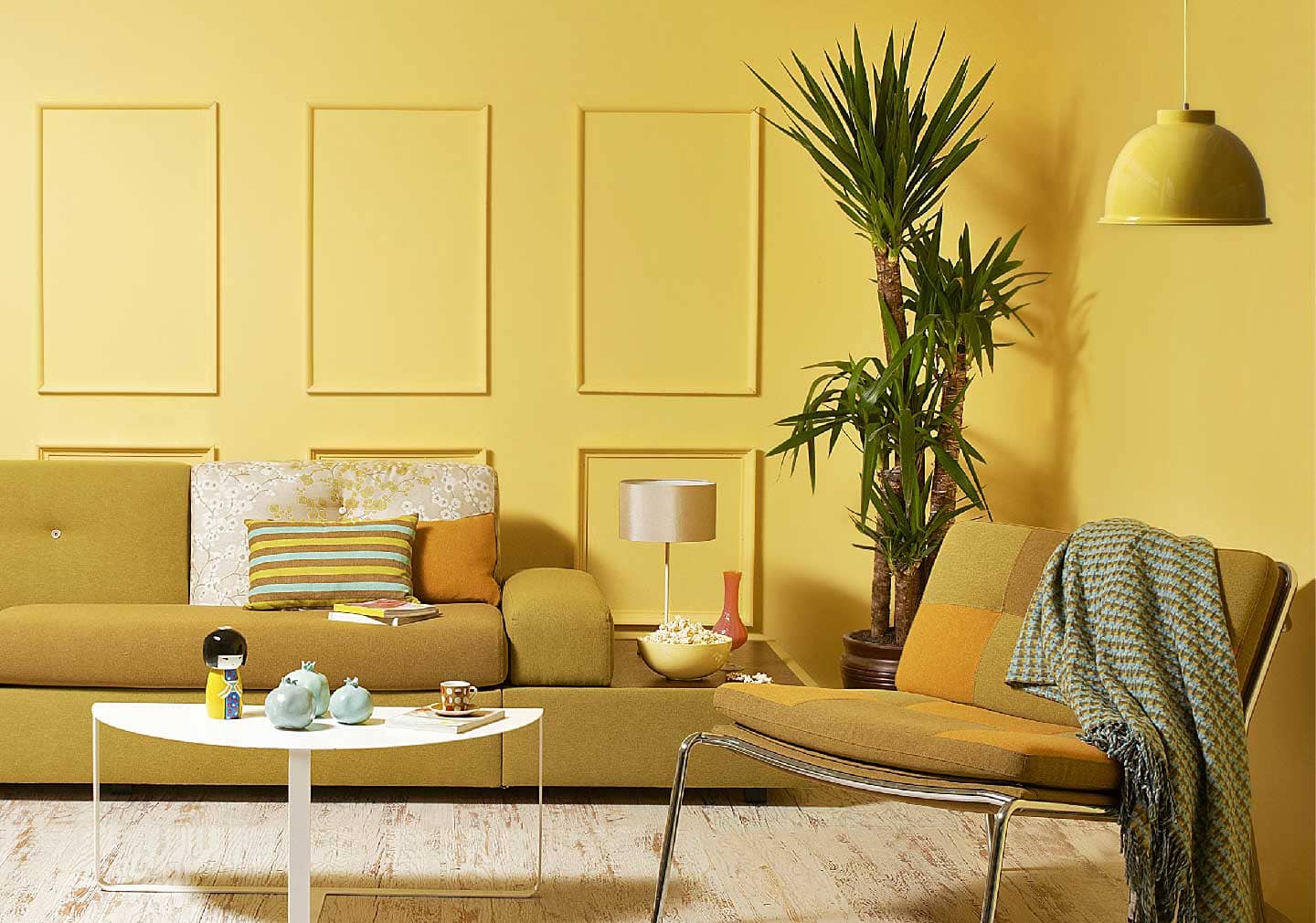 living room interiors for Valentine’s day with mustard color sofa and yellow colored base wall