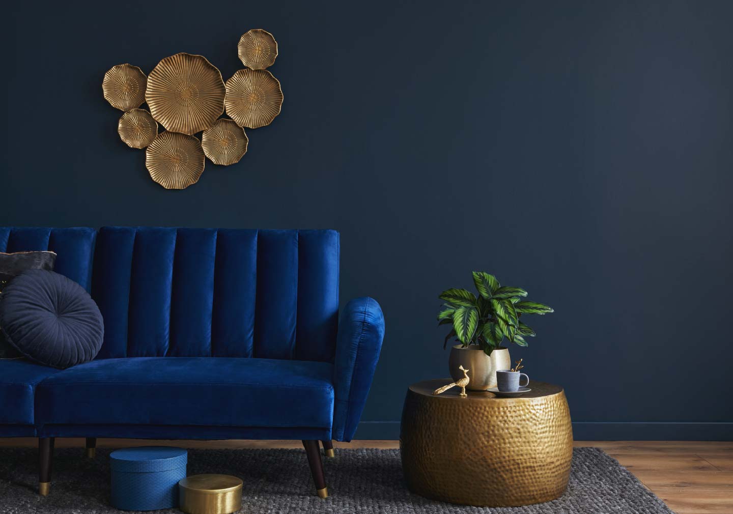 Interior Design Checklist - blue sofa with blue base wall along with a side table