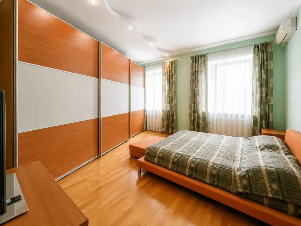 Sliding vs Hinged Shutters for Bedroom Interior Design with a Wardrobe